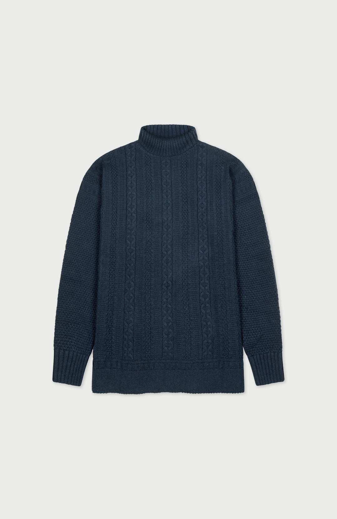 Dark blue cable paul james turtle neck knit gansey on a light gray background