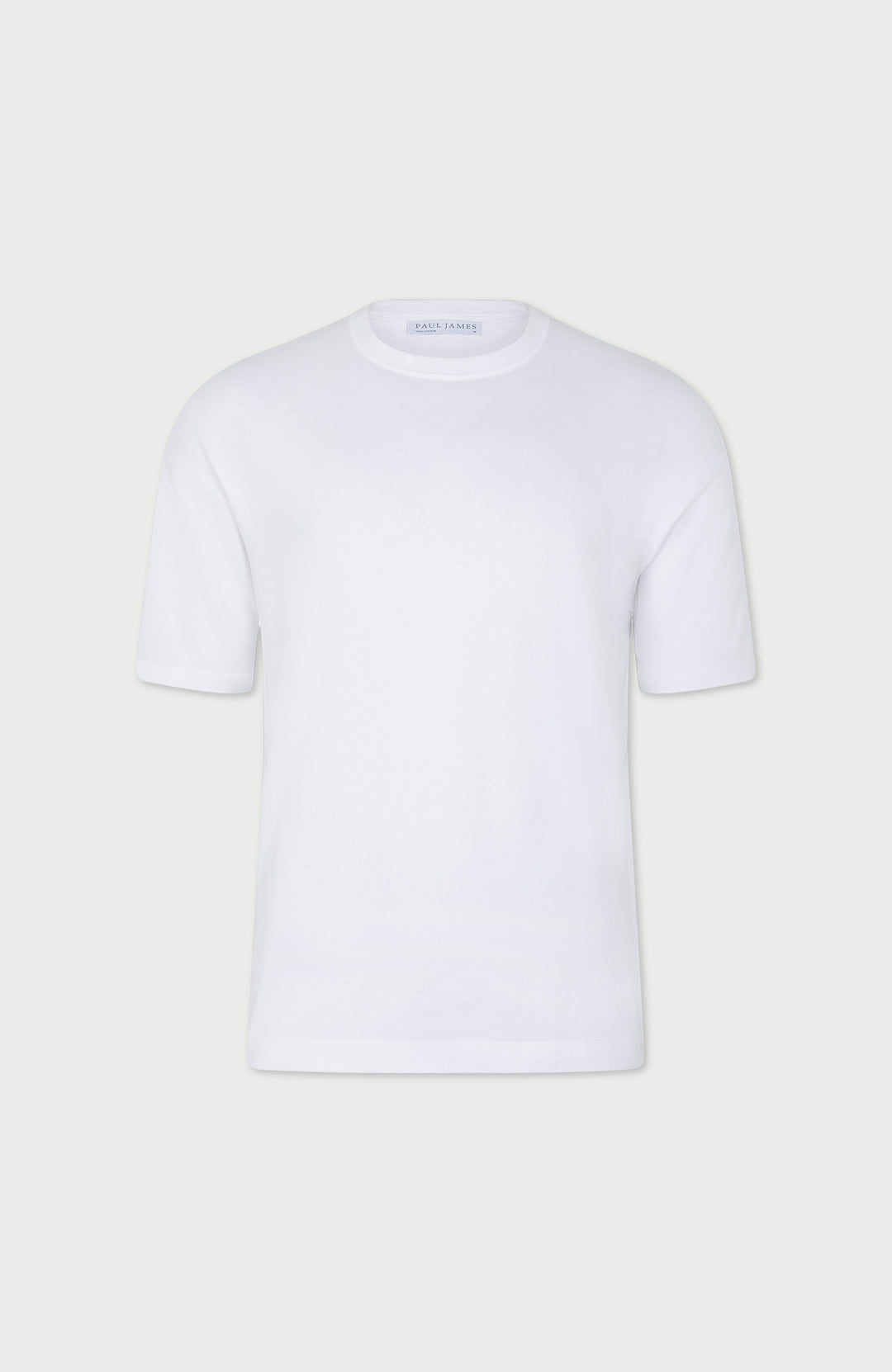 White mens relaxed t-shirt on a light gray background
