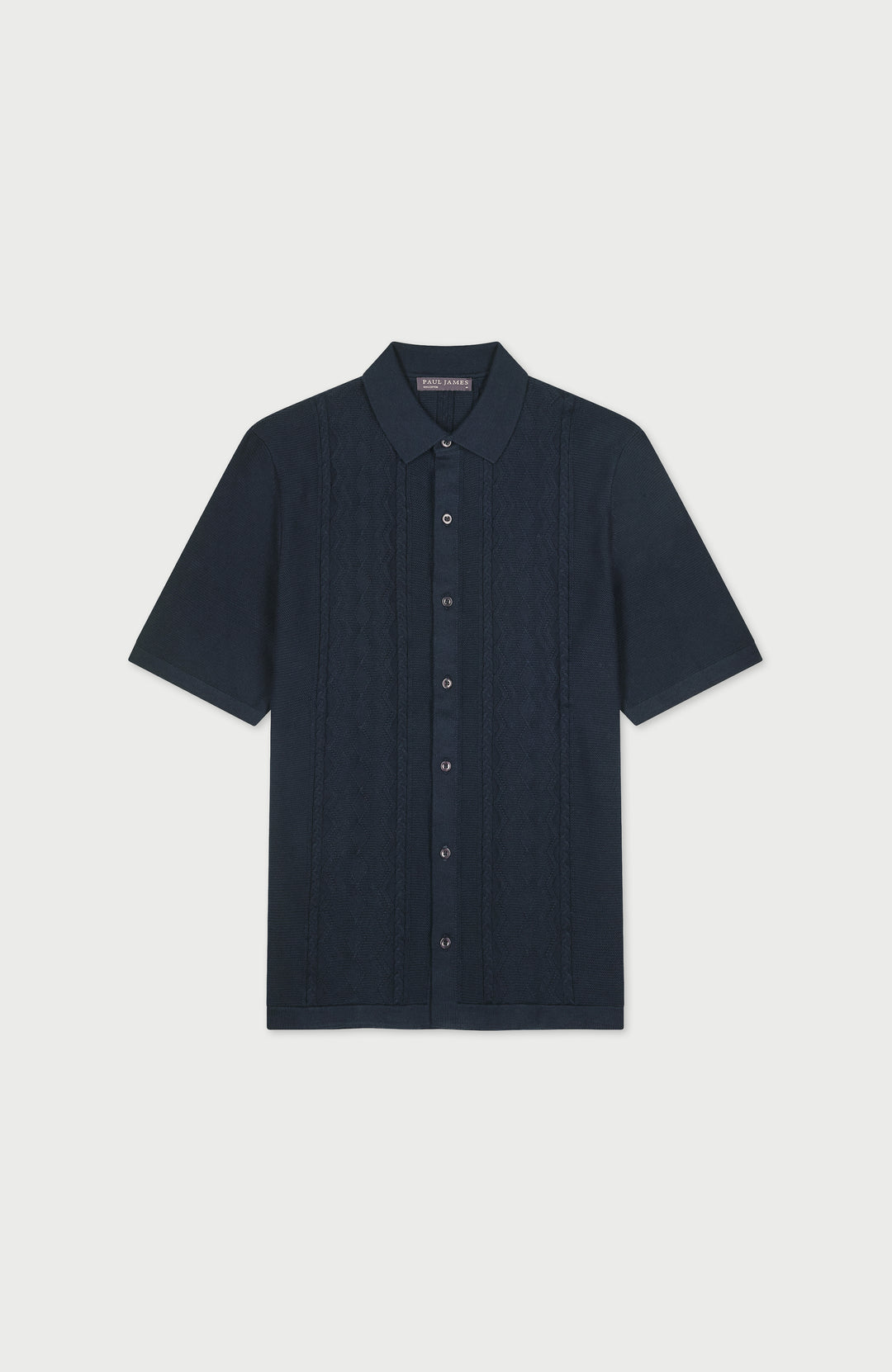 Man wearing a gansey-inspired cotton-knitted short-sleeve shirt by Paul James Knitwear
