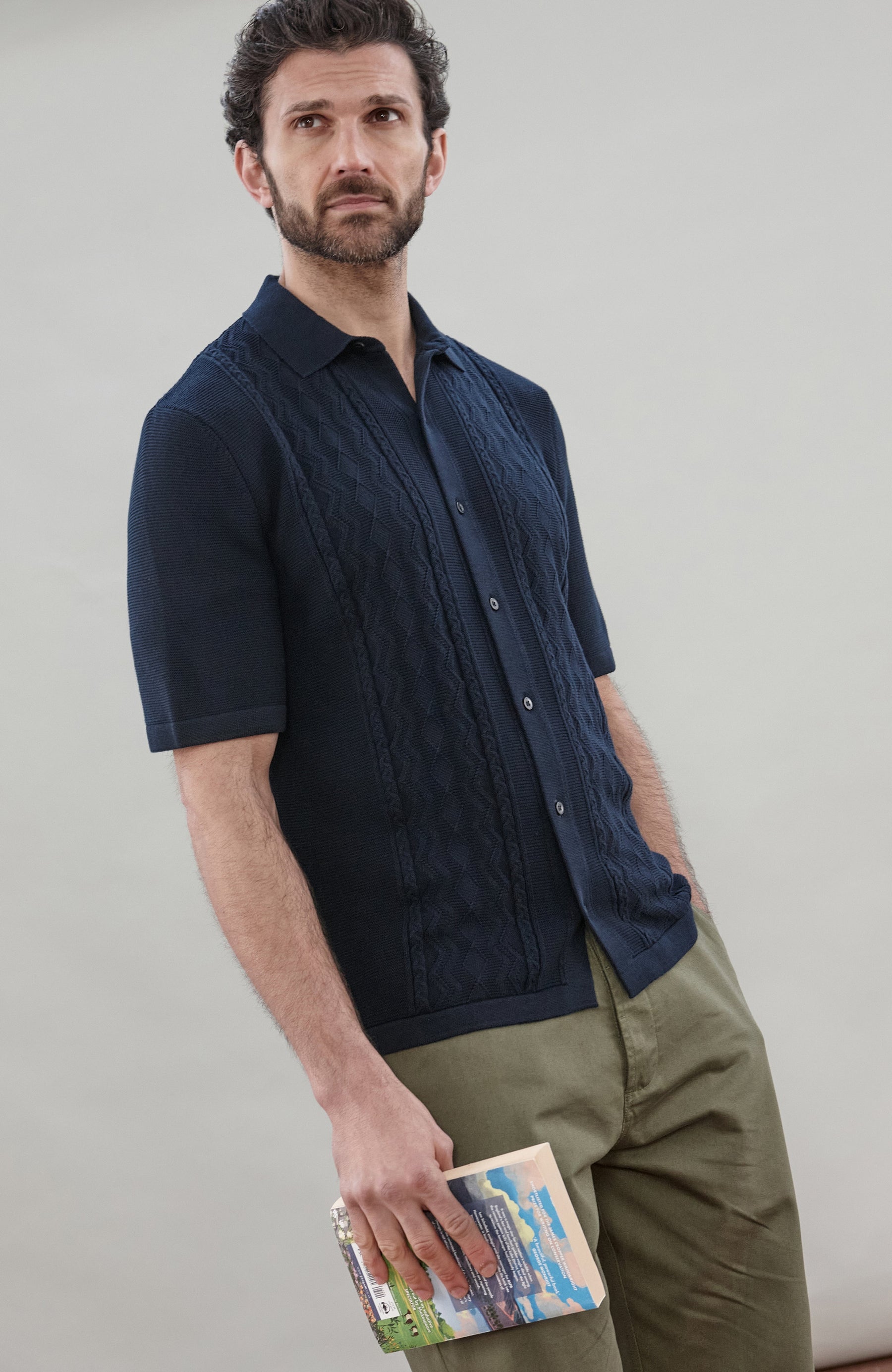 Man wearing a gansey-inspired cotton-knitted short-sleeve shirt by Paul James Knitwear 