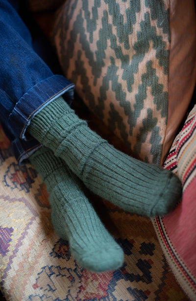 Green alpaca walking sock by Paul James Knitwear, made in England. 