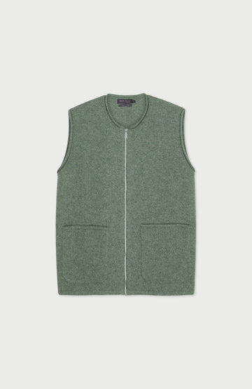 Green wool gilet by paul james with a zipper on a light gray background