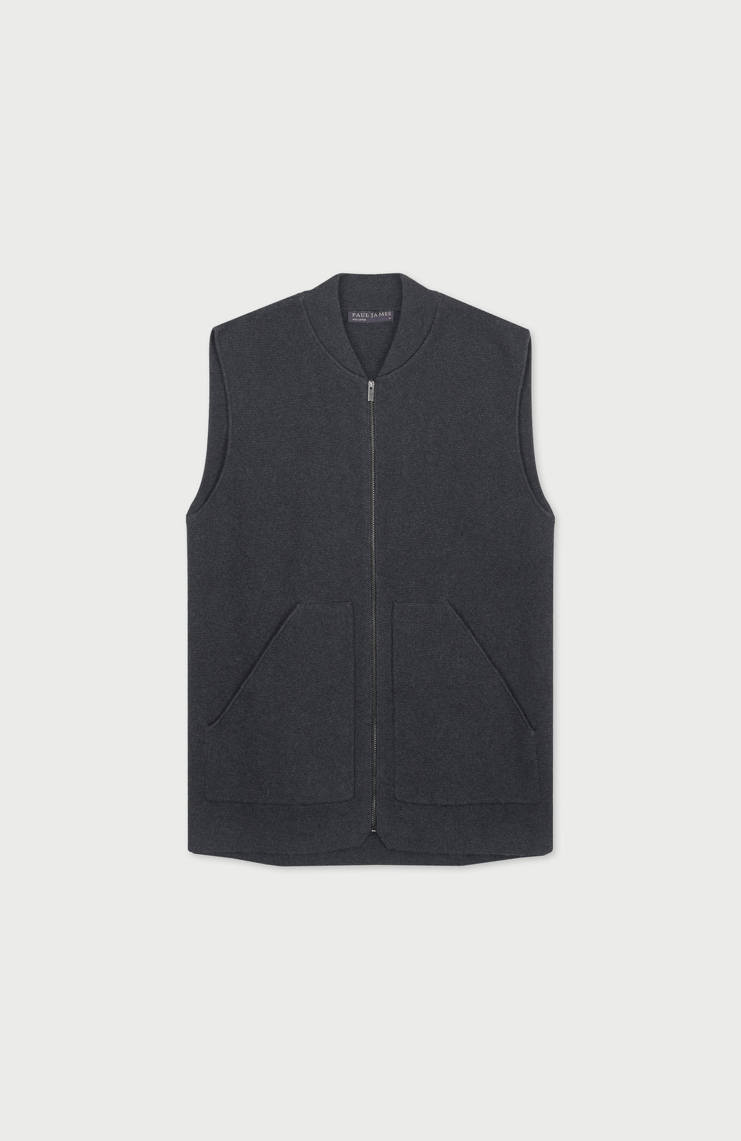 A dark gray mens zip-up vest with a ribbed collar and two front patch pockets, displayed flat against a light gray background.  Knitted in Cotton by Paul James Knitwear.