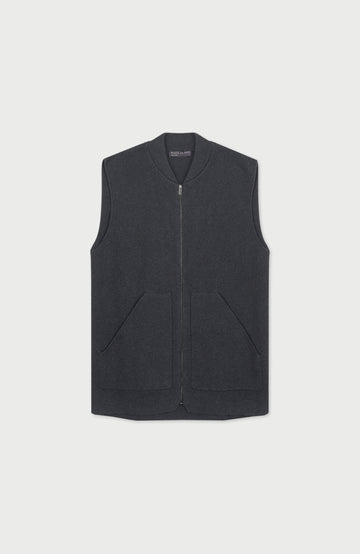 A dark gray mens zip-up vest with a ribbed collar and two front patch pockets, displayed flat against a light gray background.  Knitted in Cotton by Paul James Knitwear.