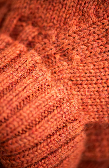 orange mens made in england wool roll neck sweater by paul james