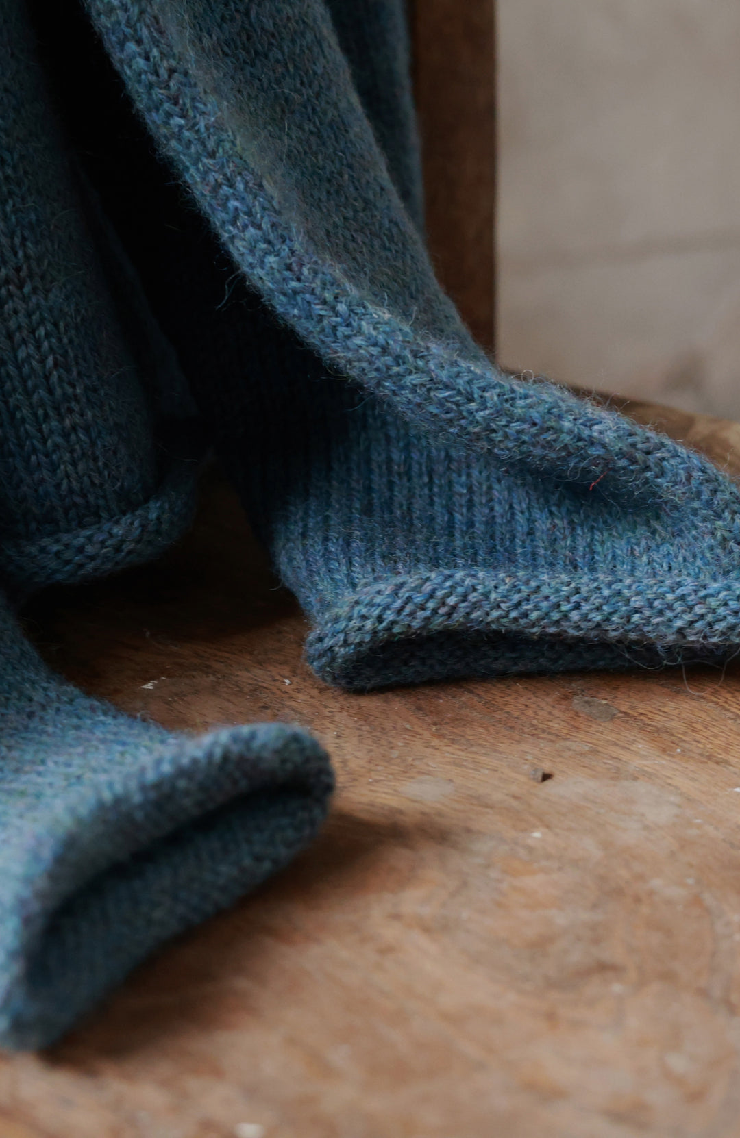 Blue men's fisherman British wool jumper with rolled hems made in England by Paul James Knitwear.