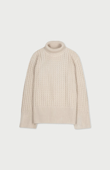 A womens cotton cream-colored, textured cable-knit mock neck sweater displayed flat against a light gray background. Made by Paul James Knitwear.
