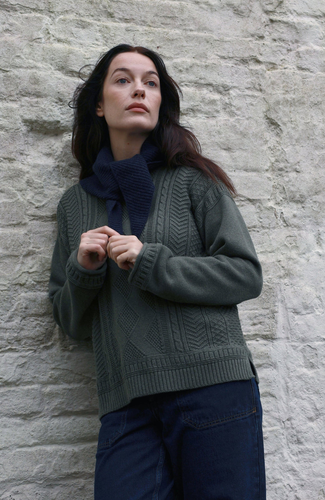 Green women's fisherman's gansey sweater with rolled edge trims by Paul James Knitwear. 