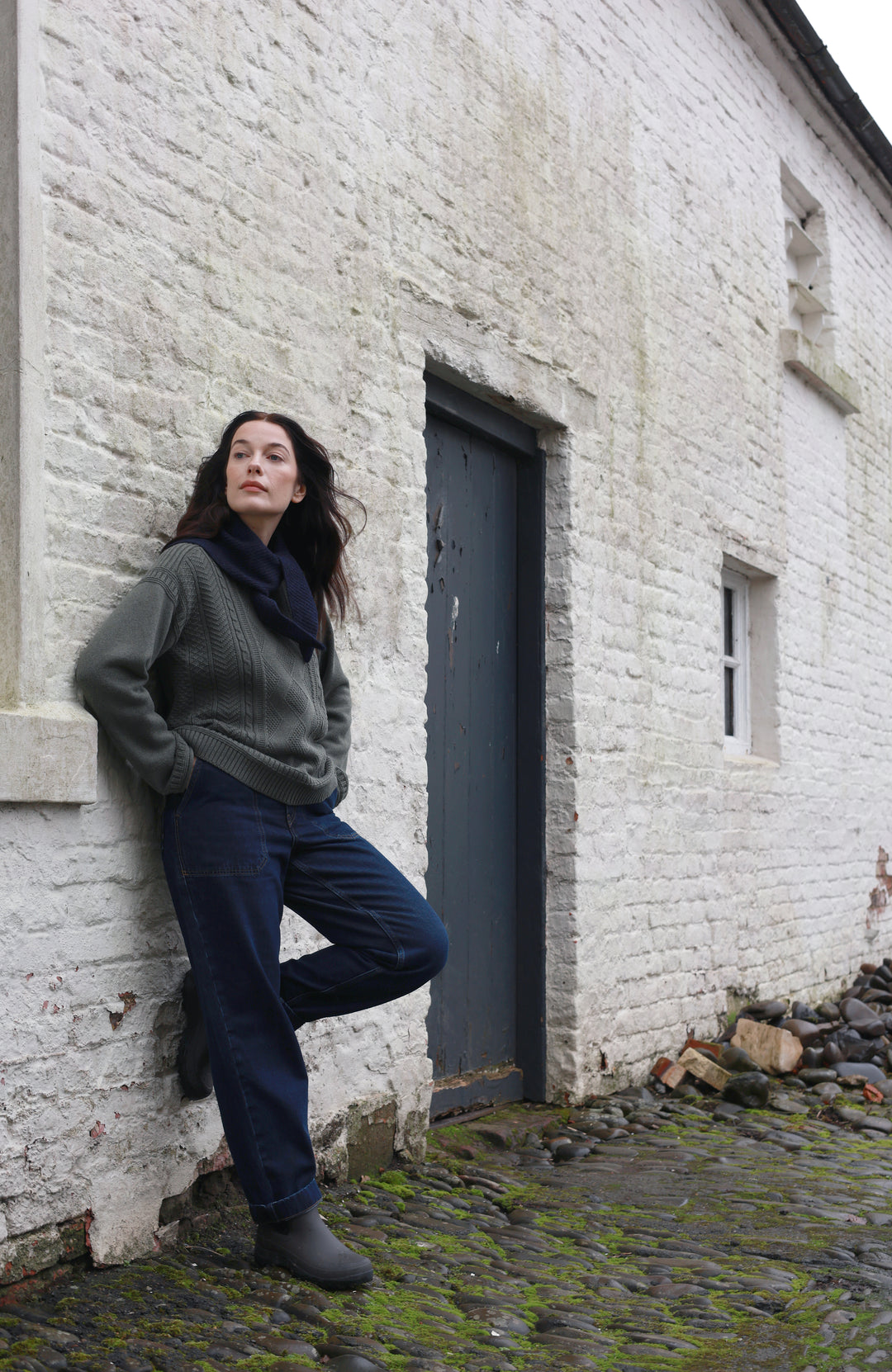 Green women's fisherman's gansey sweater with rolled edge trims by Paul James Knitwear.