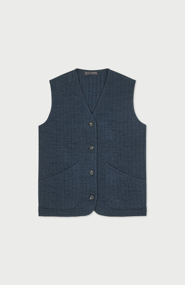 A womens dark blue textured quilted vest with a button-up front and front pockets, displayed flat against a light gray background by Paul James Knitwear