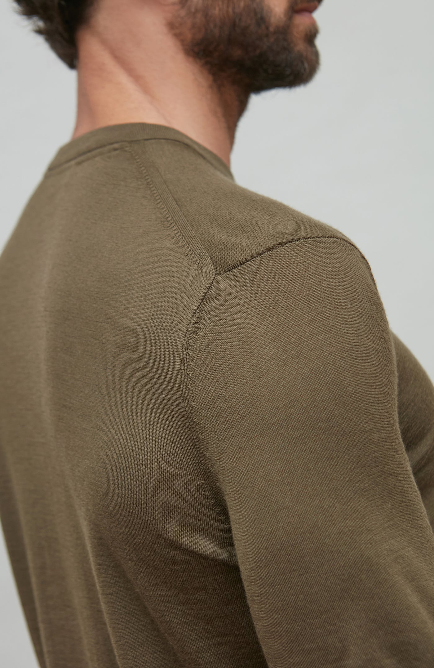 man wearing green merino wool t-shirt