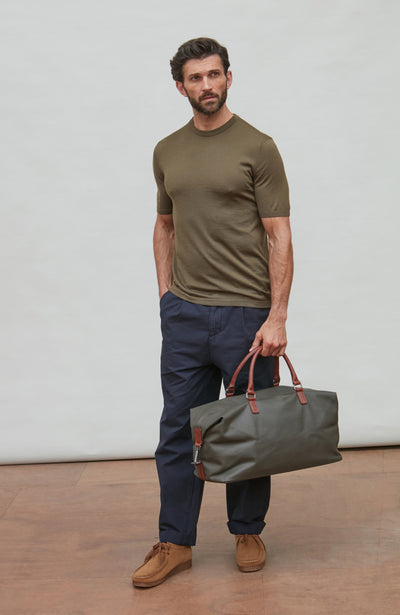man wearing green merino wool t-shirt