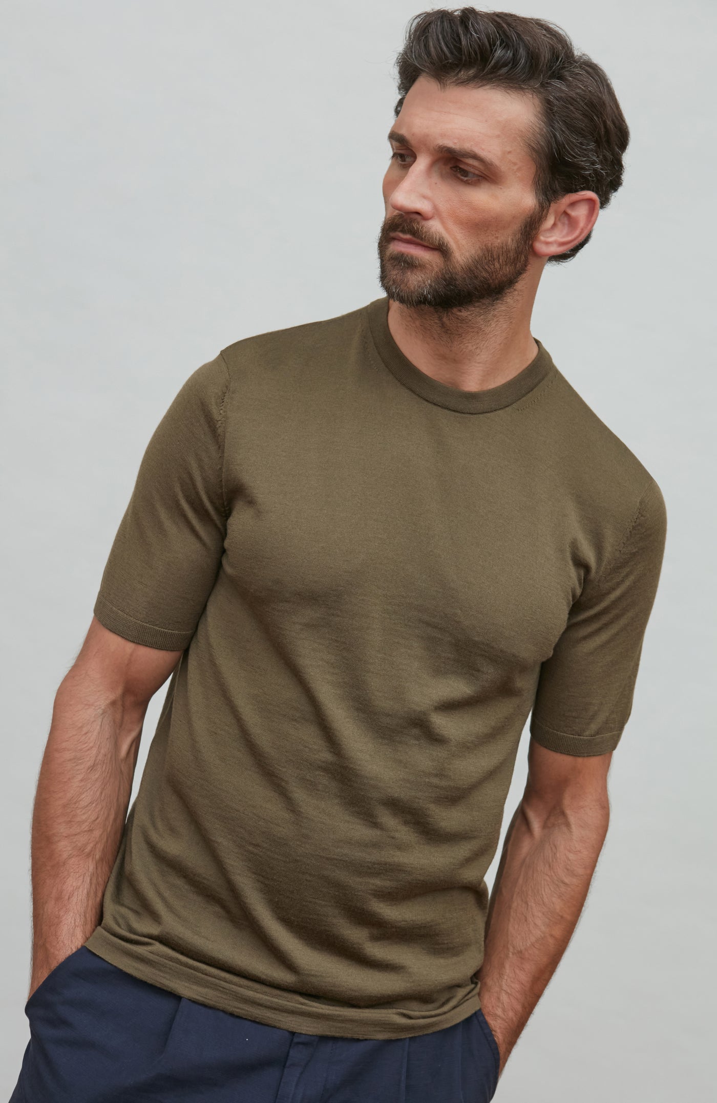 man wearing green merino wool t-shirt