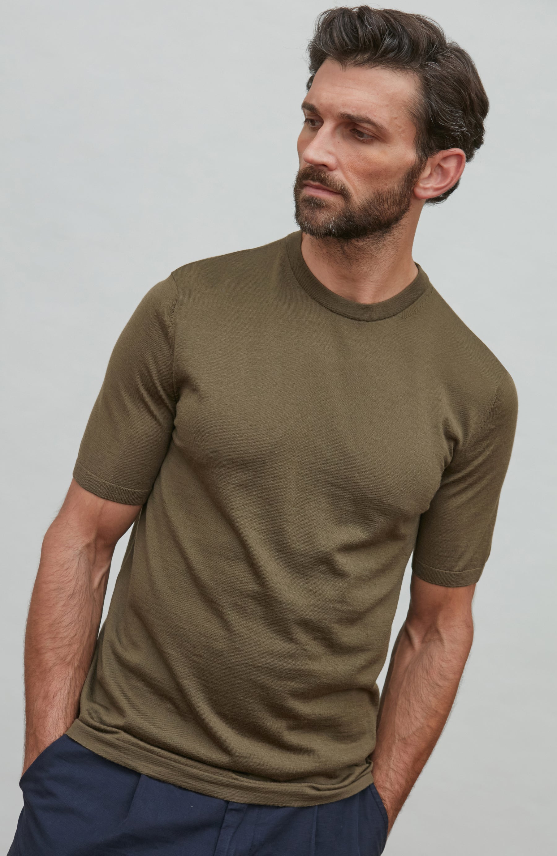 man wearing green merino wool t-shirt