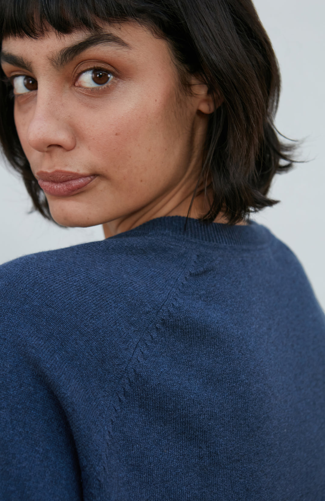 Blue women's deep V-neck cotton jumper by Paul James Knitwear