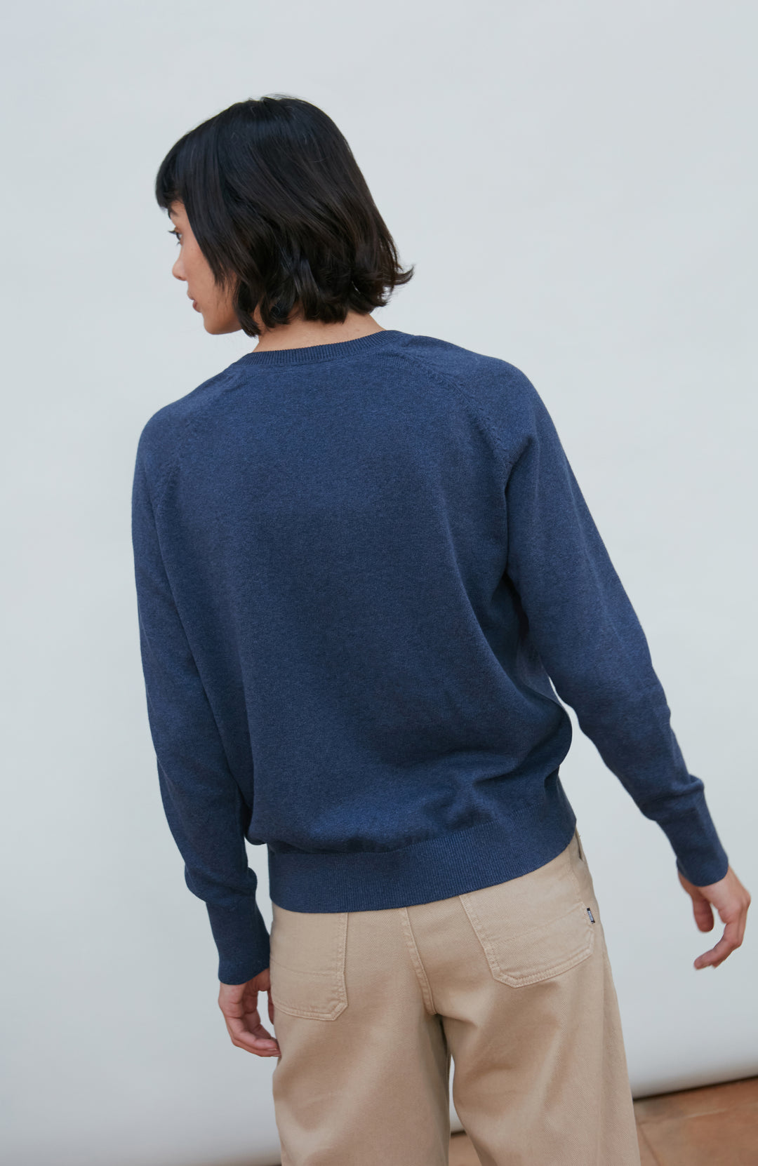 Blue women's deep V-neck cotton jumper by Paul James Knitwear