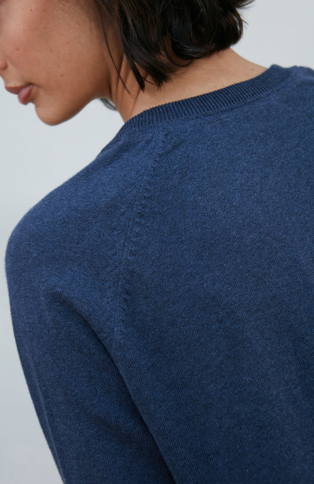 Blue women's deep V-neck cotton jumper by Paul James Knitwear