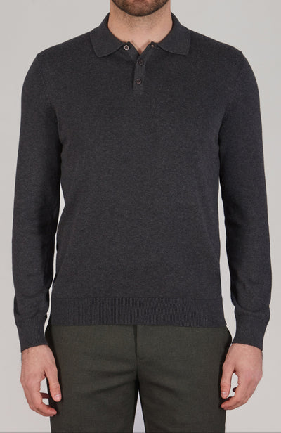 Man wearing a dark gray long-sleeve polo shirt against a plain background