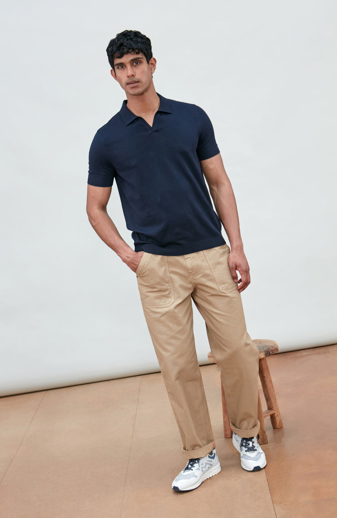 Navy men's short-sleeve polo shirt by Paul James Knitwear, buttonless