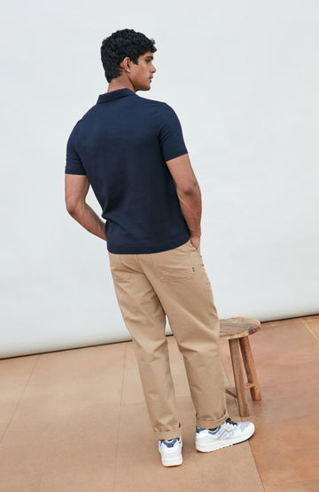 Navy men's short-sleeve polo shirt by Paul James Knitwear, buttonless