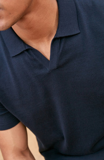 Navy men's short-sleeve polo shirt by Paul James Knitwear, buttonless