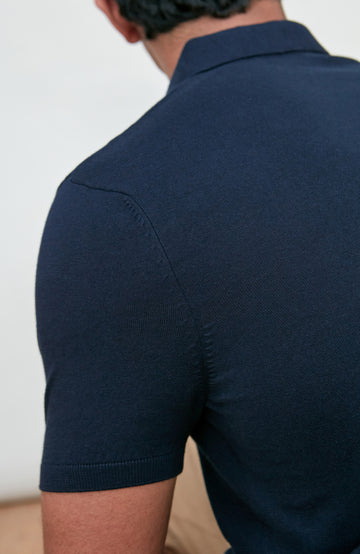 Navy men's short-sleeve polo shirt by Paul James Knitwear, buttonless