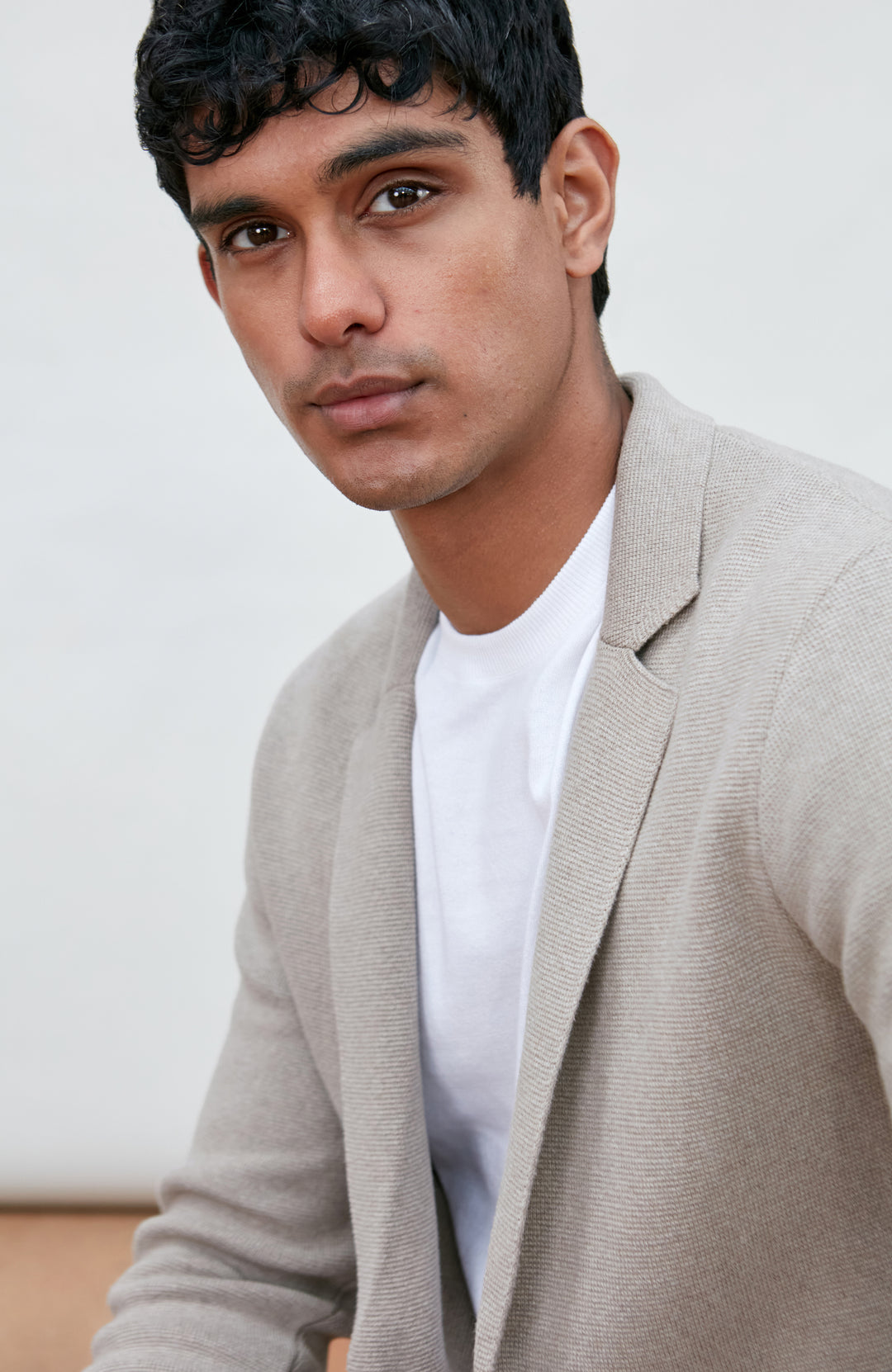 Men's beige unstructured cotton knitted blazer by Paul James Knitwear.