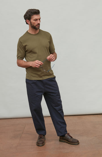 man wearing dark green cotton t-shirt