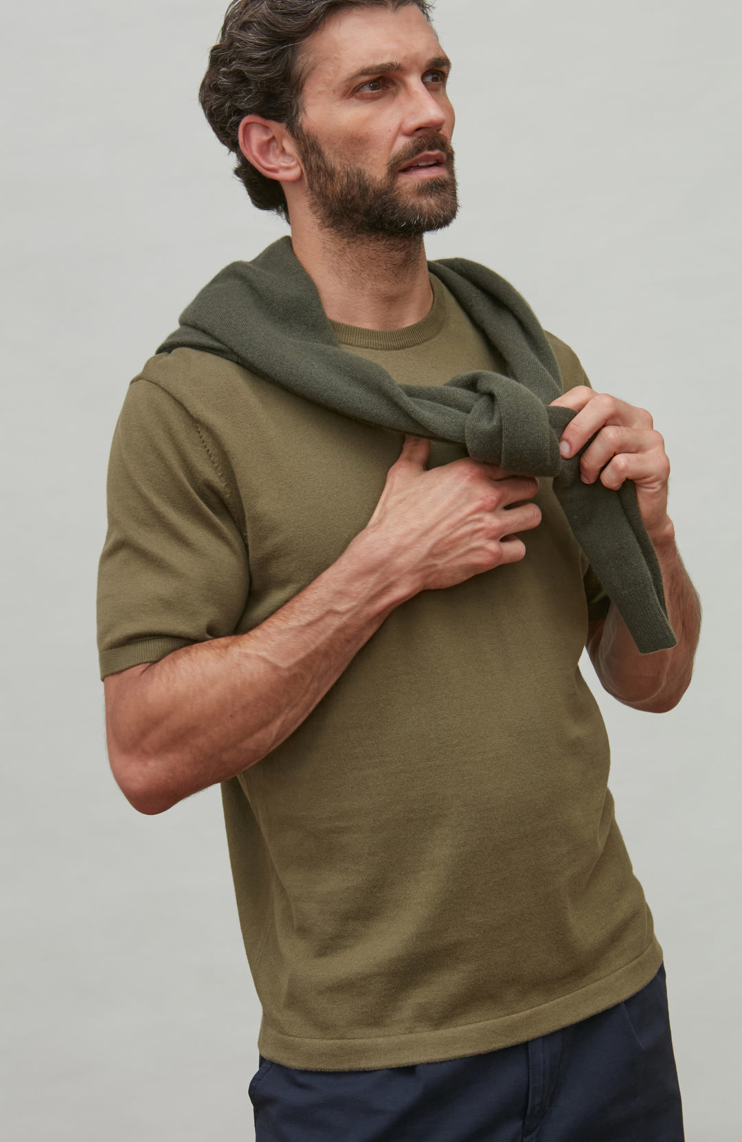 man in cashmere green jumper with green t-shirt by Paul James