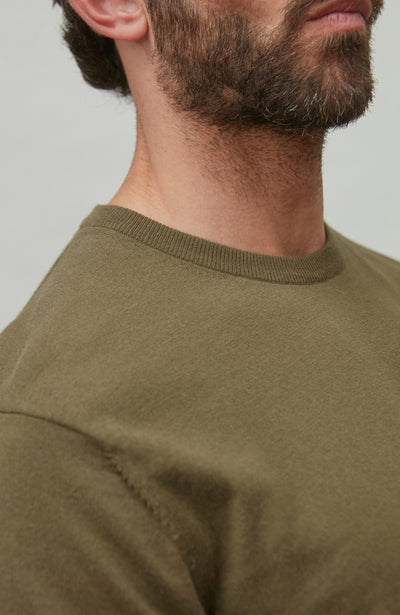 man wearing dark green cotton t-shirt