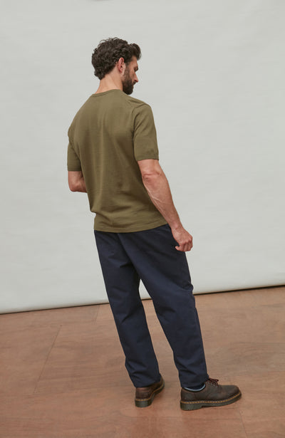 man wearing dark green cotton t-shirt