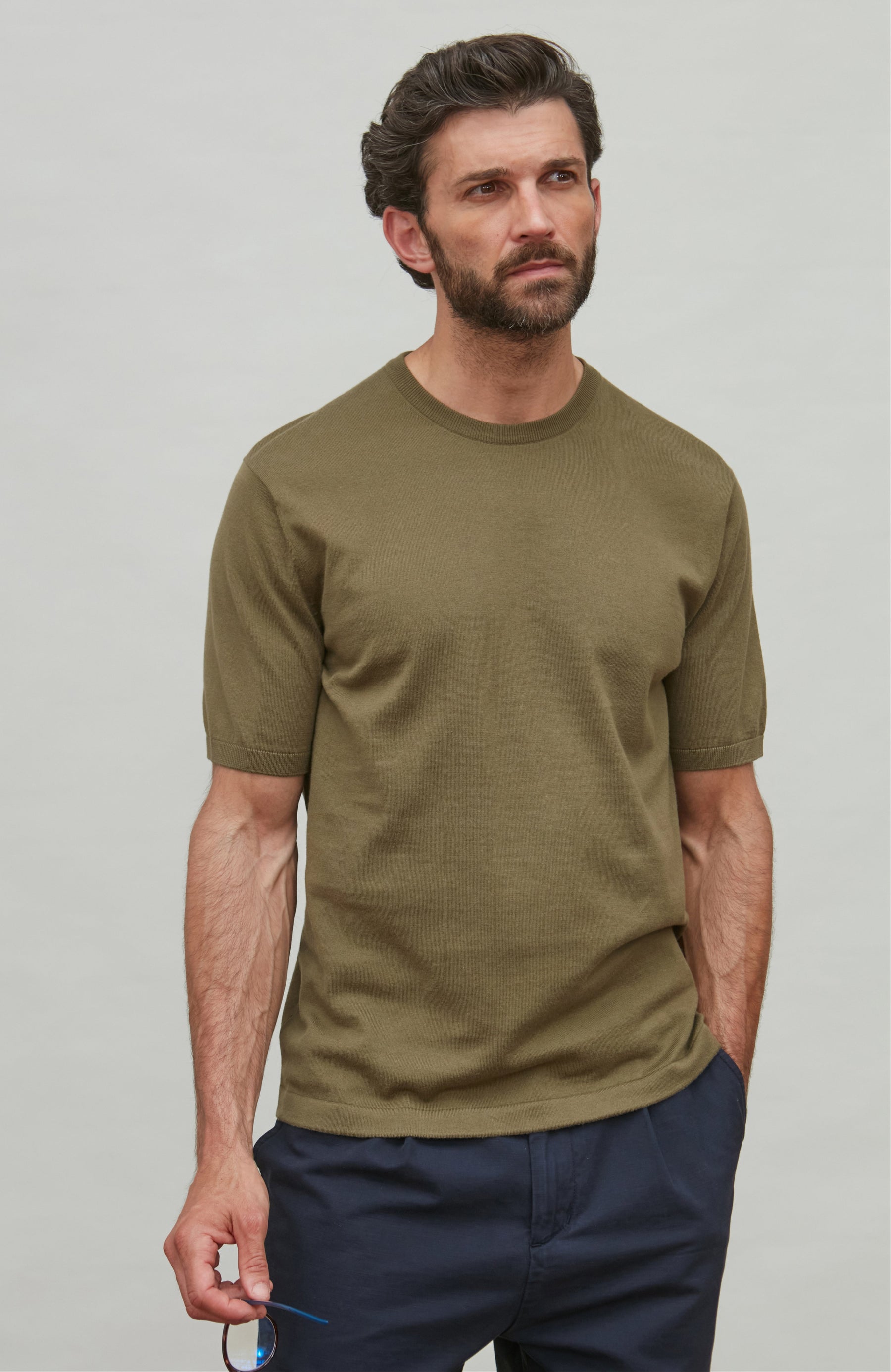 man wearing dark green cotton t-shirt