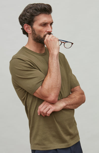 man wearing dark green cotton t-shirt