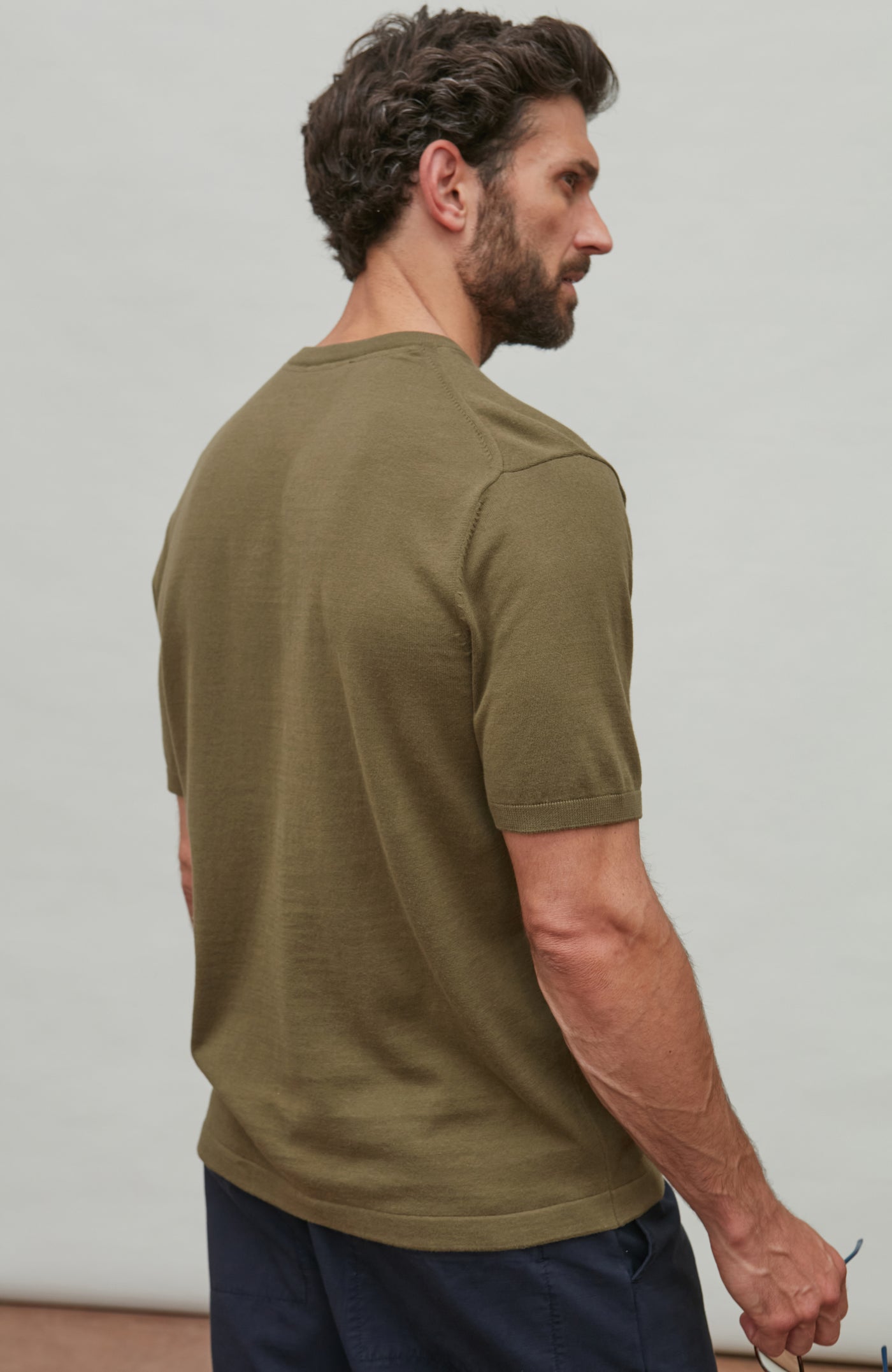 man wearing dark green cotton t-shirt