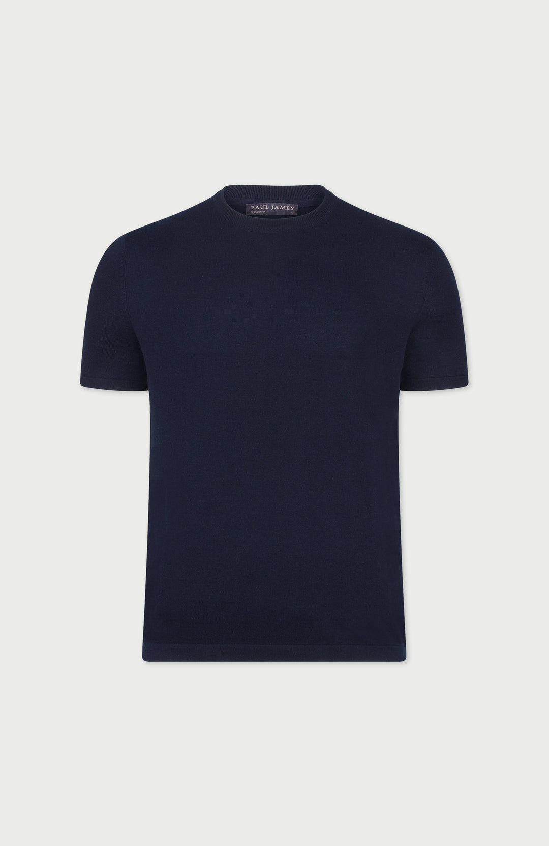 Navy blue cotton t-shirt on a light gray background Made by Paul James Knitwear.
