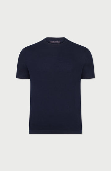 Navy blue cotton t-shirt on a light gray background Made by Paul James Knitwear.
