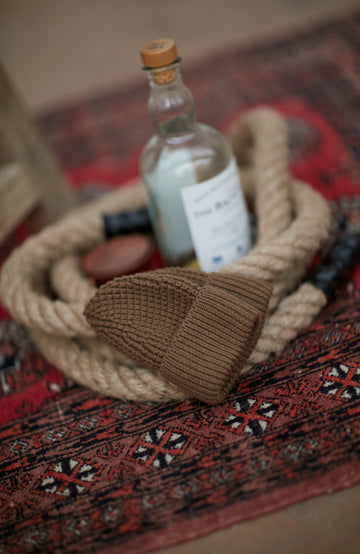 brown beanie hat fisherman scene by Paul James