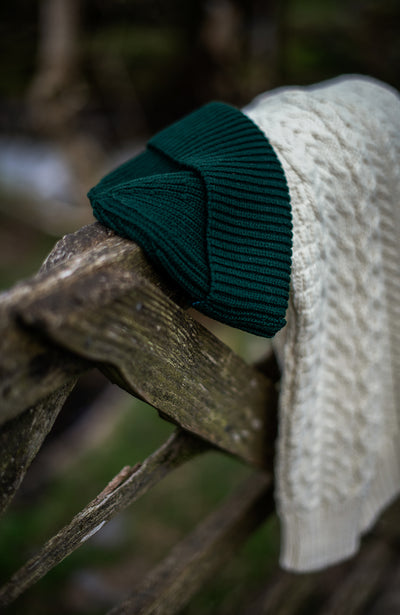 green mens fisherman beanie hat and cable jumper