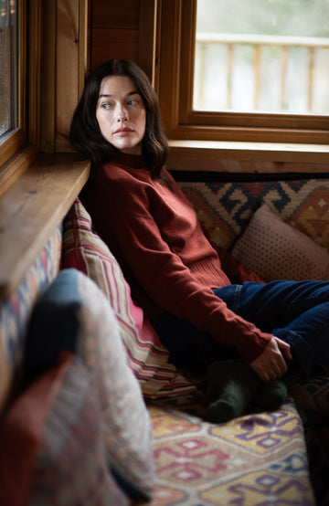 Dark red-orange women's made-in-England lambswool jumper by Paul James Knitwear