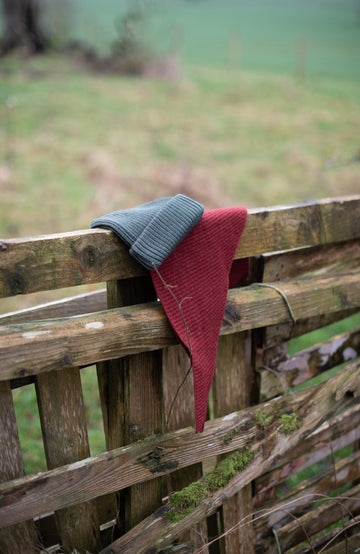 Red wool Triangle Scarf by Paul James Knitwear