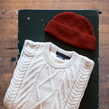 red fisherman beanie with wool chunky jumper by Paul James