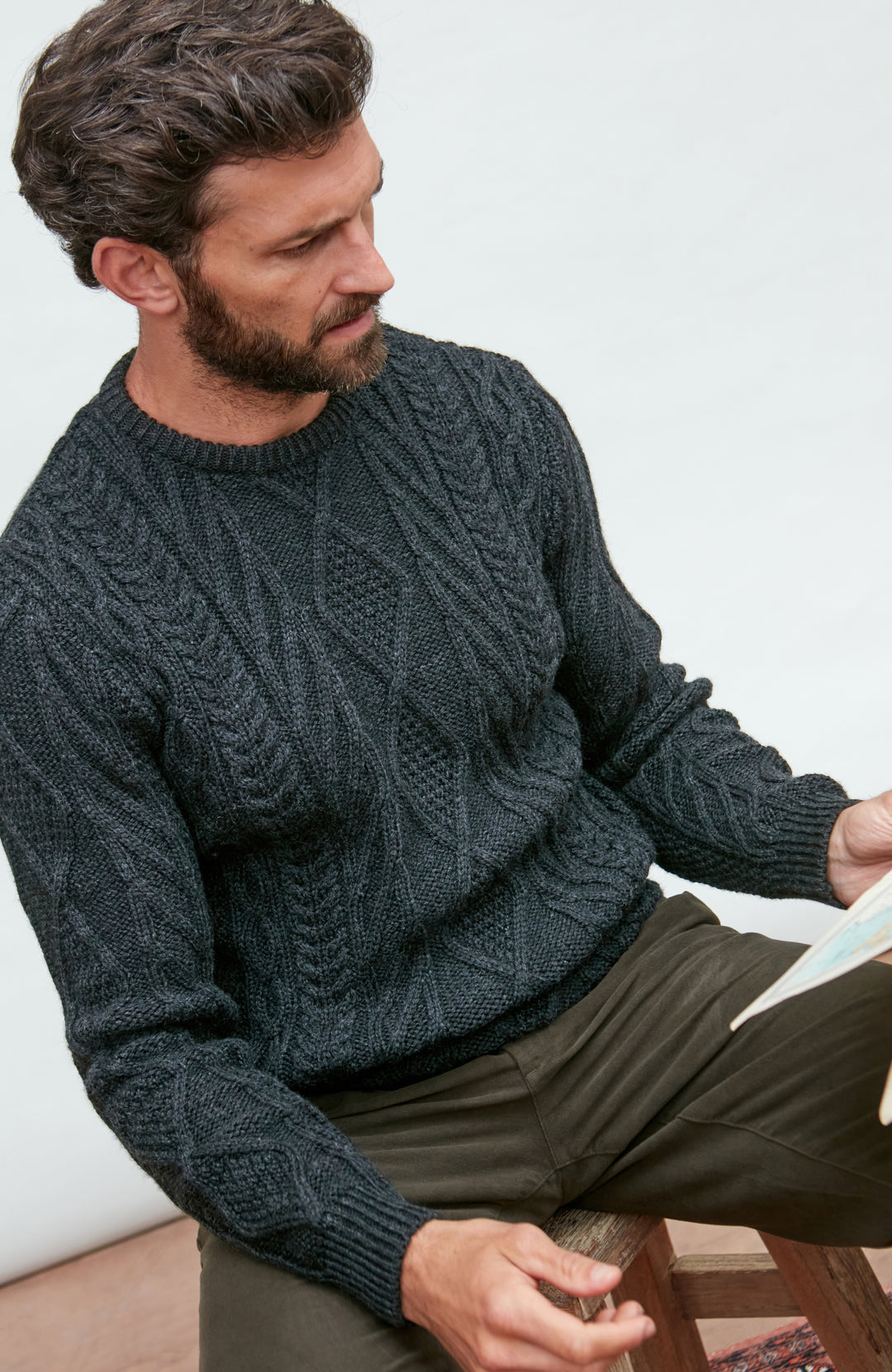 black mens chunky merino wool cable jumper by Paul James