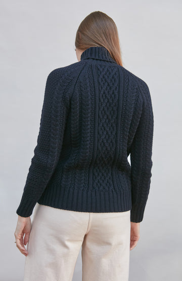 Womens wearing navy chunky wool cable sweater by Paul James