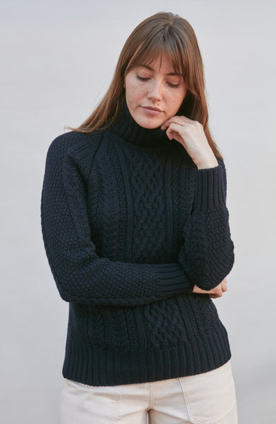 womens wearing navy chunky wool cable sweater
