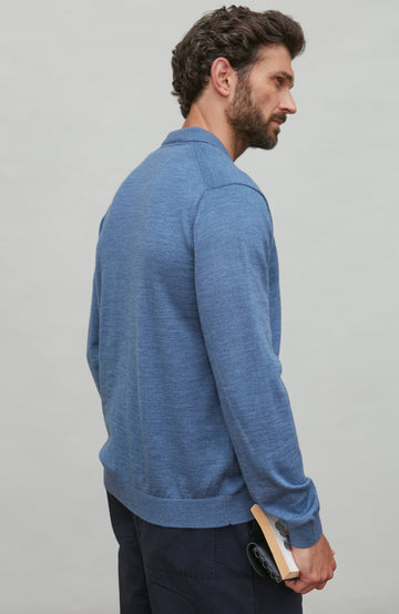 Man wearing a denim blue merino wool button-up shirt against a gray background by Paul James
