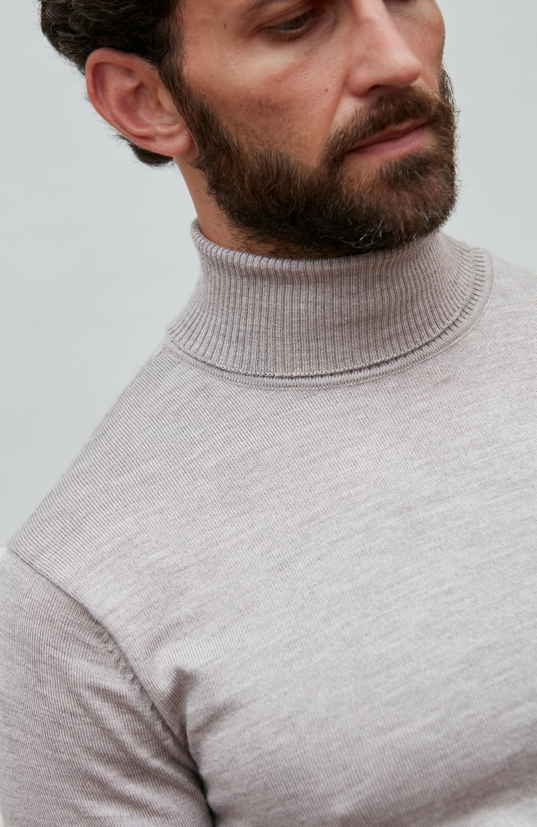 beige fine merino wool roll neck jumper by Paul James