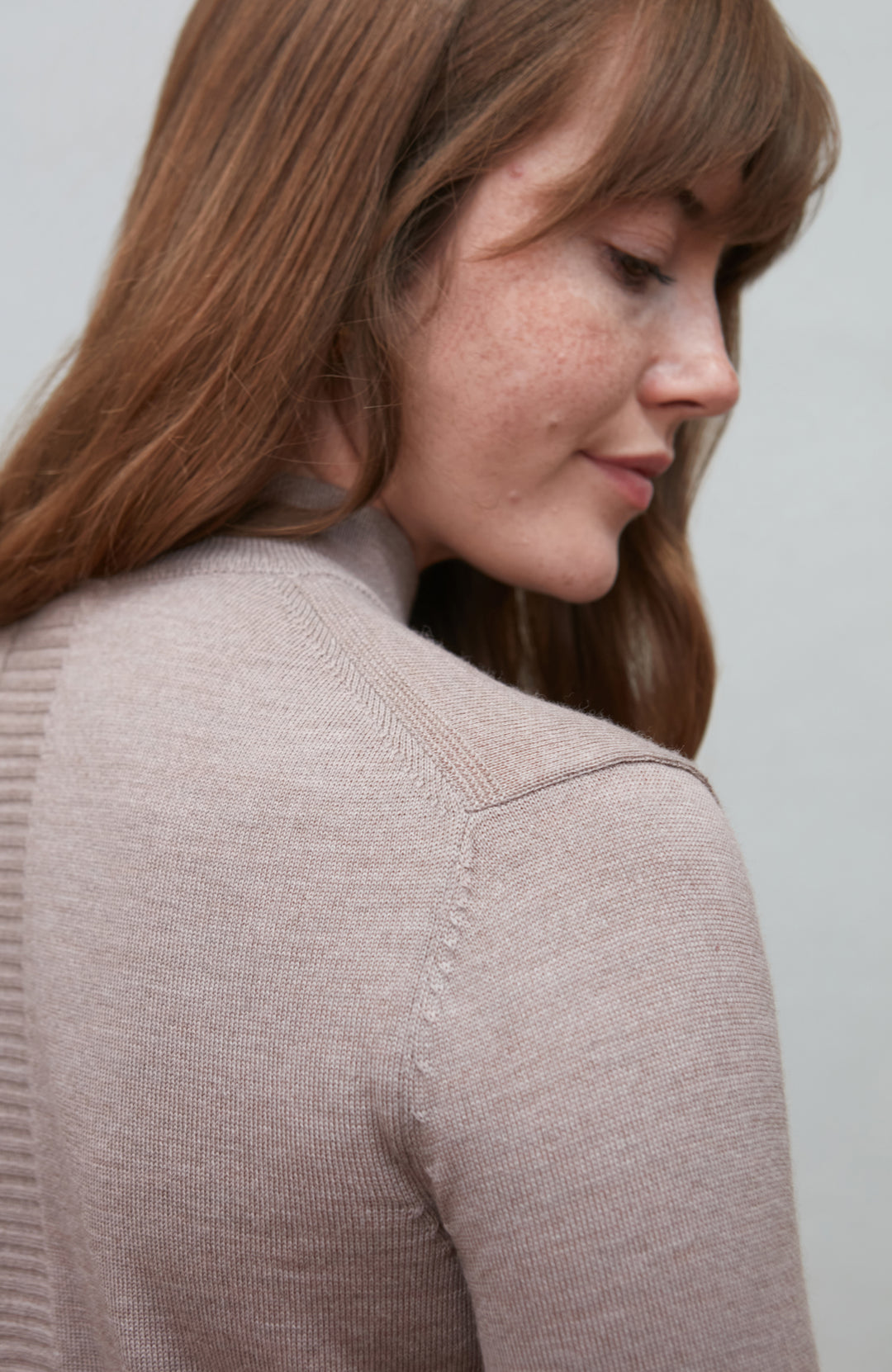 Beige women's extra fine merino wool mock neck jumper with back detail by Paul James Knitwear