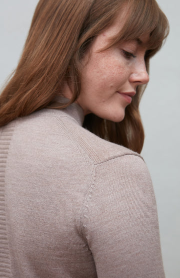 Beige women's extra fine merino wool mock neck jumper with back detail by Paul James Knitwear