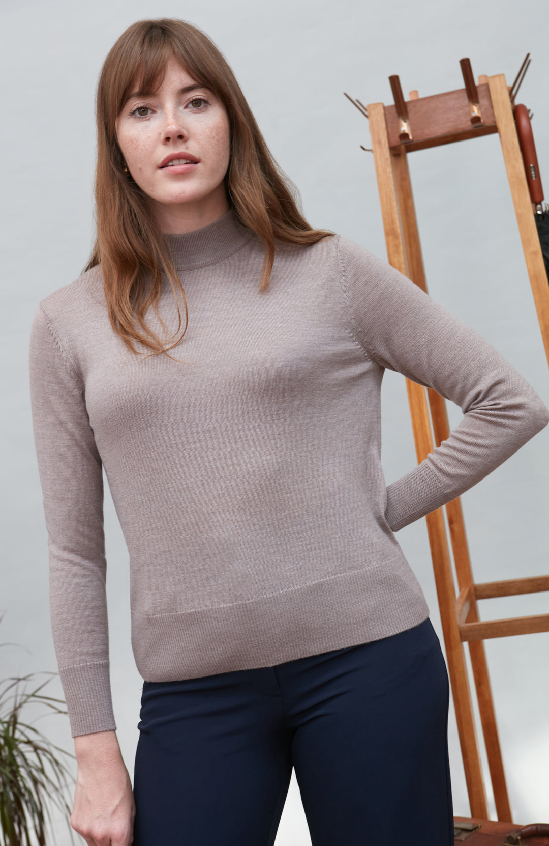 Beige women's extra fine merino wool mock neck jumper with back detail by Paul James Knitwear