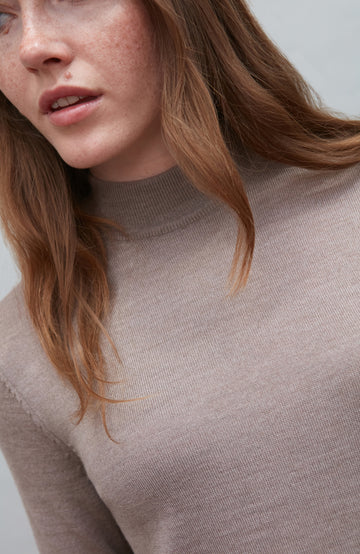 Beige women's extra fine merino wool mock neck jumper with back detail by Paul James Knitwear